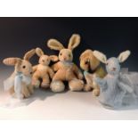 A Steiff blonde mohair rabbit, resting on his haunches, trademark button to ear,
