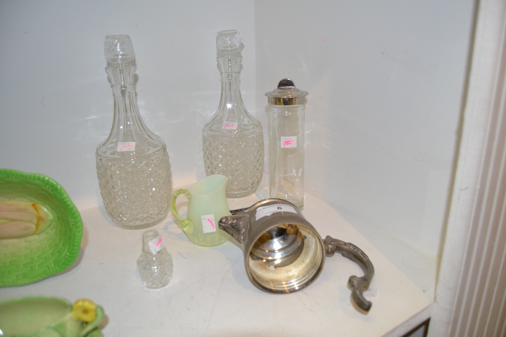 A pair of glass decanters;  another,