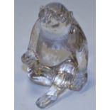 A rock crystal monkey, seated upright, with legs crossed, 7.