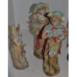 A pair of continental bisque figures,