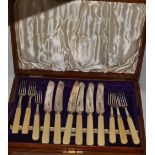 A canteen of six silver plated table knives and forks, ivorine hafted,