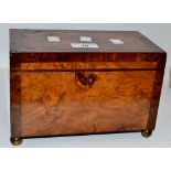 A George III  burr walnut tea caddy, the interior with two lidded compartments, brass ball feet, c.