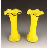 A pair of Loetz style slender cylindrical vases, in vivid yellow,