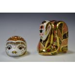 A Royal Crown Derby paperweight Imari Serpent, gold stopper;  another Mistletoe Hedgehog ,