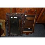 A 19th century mahogany Vauxhall mirror;  another,