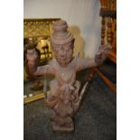 A large Asian hardwood carving, of a dancing figure, in ritual dress, 64cm high, probably Thailand,