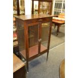 An early 20th Century oak display cabinet,