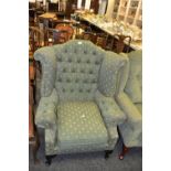 A 20th Century wingback arm chair,