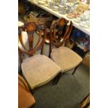 A pair of Edwardian mahogany side chairs, harp back, inlaid in coloured woods, c.