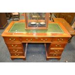 A 20th century walnut twin pedestal desk , tooled leather writing surface ,