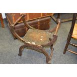 A 19th century beech X frame stool,
