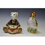 A Royal Crown Derby paperweight Seated Drummer Bear, gold stopper;  another Green Winged Teal,