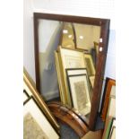 A rectangular mirror, cushion frame, 100cm x 70cm;  another, arched,