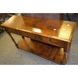 A good 20th century reproduction oak dresser base, three drawers to frieze,