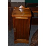 A stained mahogany bedside cabinet