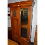 A 20th century pine wardrobe , moulded top ,