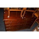 A 20th Century dark mahogany chest fitted with blind drawers
