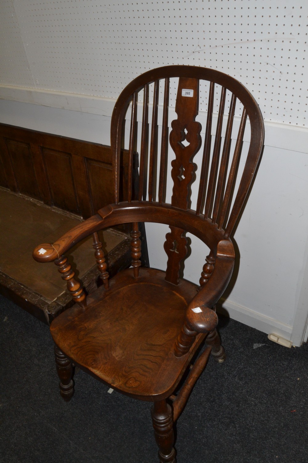 A 19th century beech and elm hoop back Windsor smoker bow chair, pierced vasular splat, shaped seat,