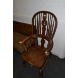 A 19th century beech and elm hoop back Windsor smoker bow chair, pierced vasular splat, shaped seat,