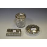 A round cut glass jar , chased silver lid, Chester 1895; a rectangular cut glass dressing table box,