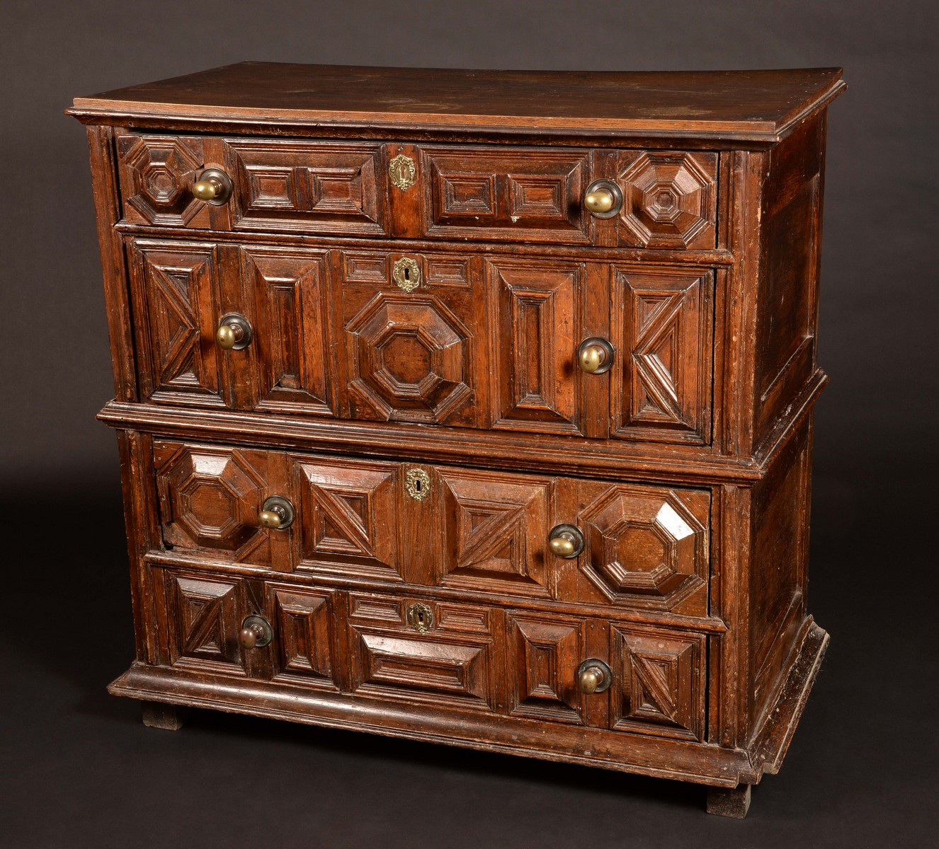 An 'early 18th century' oak block fronted chest, of four long graduated drawers, 110cm high,