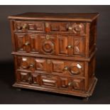 An 'early 18th century' oak block fronted chest, of four long graduated drawers, 110cm high,