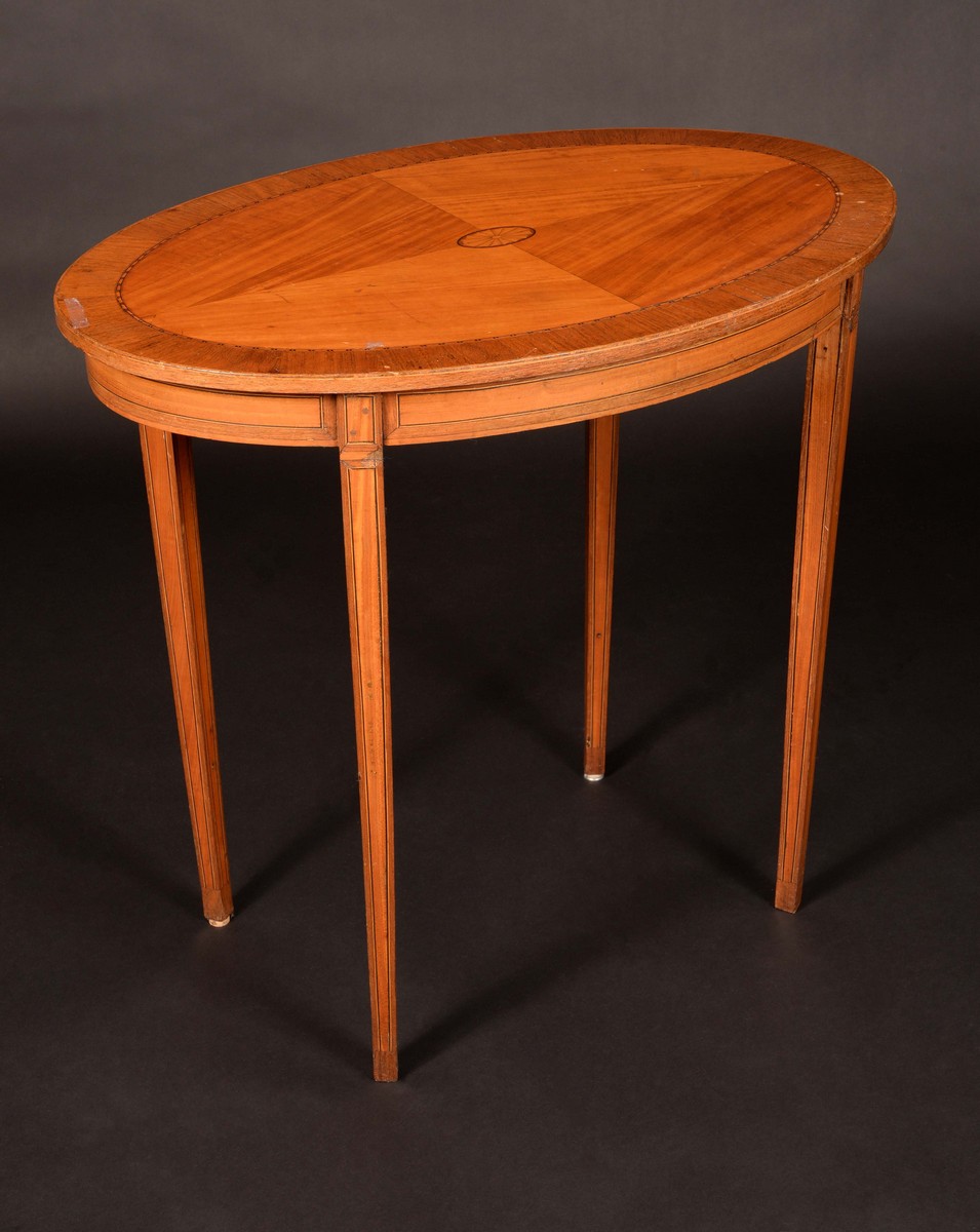An Edwardian rosewood crossbanded satinwood oval centre table,
