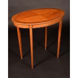 An Edwardian rosewood crossbanded satinwood oval centre table,