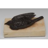 A 19th century desk weight, cast with a bronze dead song bird, on rectangular white marble base,