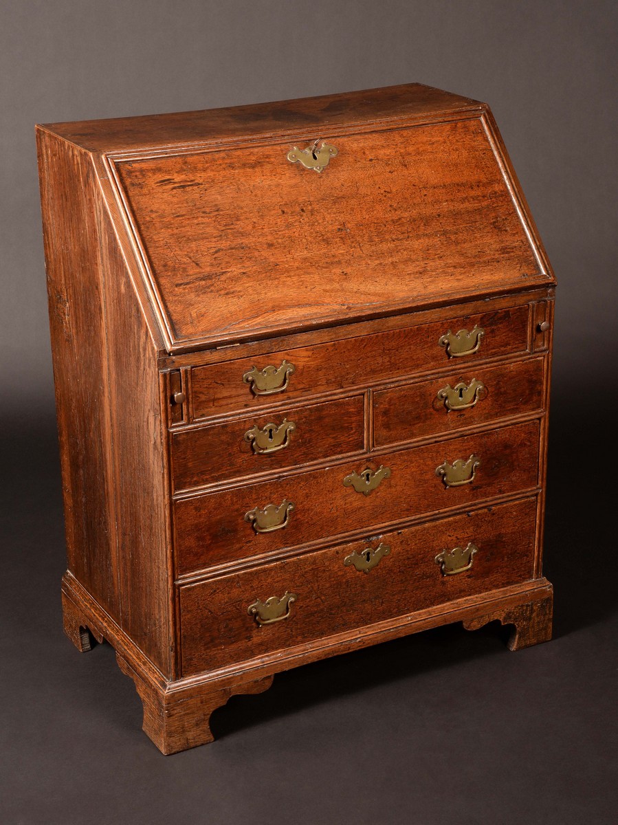 An early George III oak bureau, of small proportions,