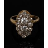 A fourteen stone diamond oval cluster ring,