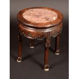 A Chinese padouk wood shaped circular jardiniere stand,