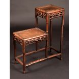 A Chinese hardwood two-level jardiniere stand, rectangular plateaux arranged asymmetrically,