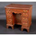 A 19th Century mahogany and rosewood kneehole desk,