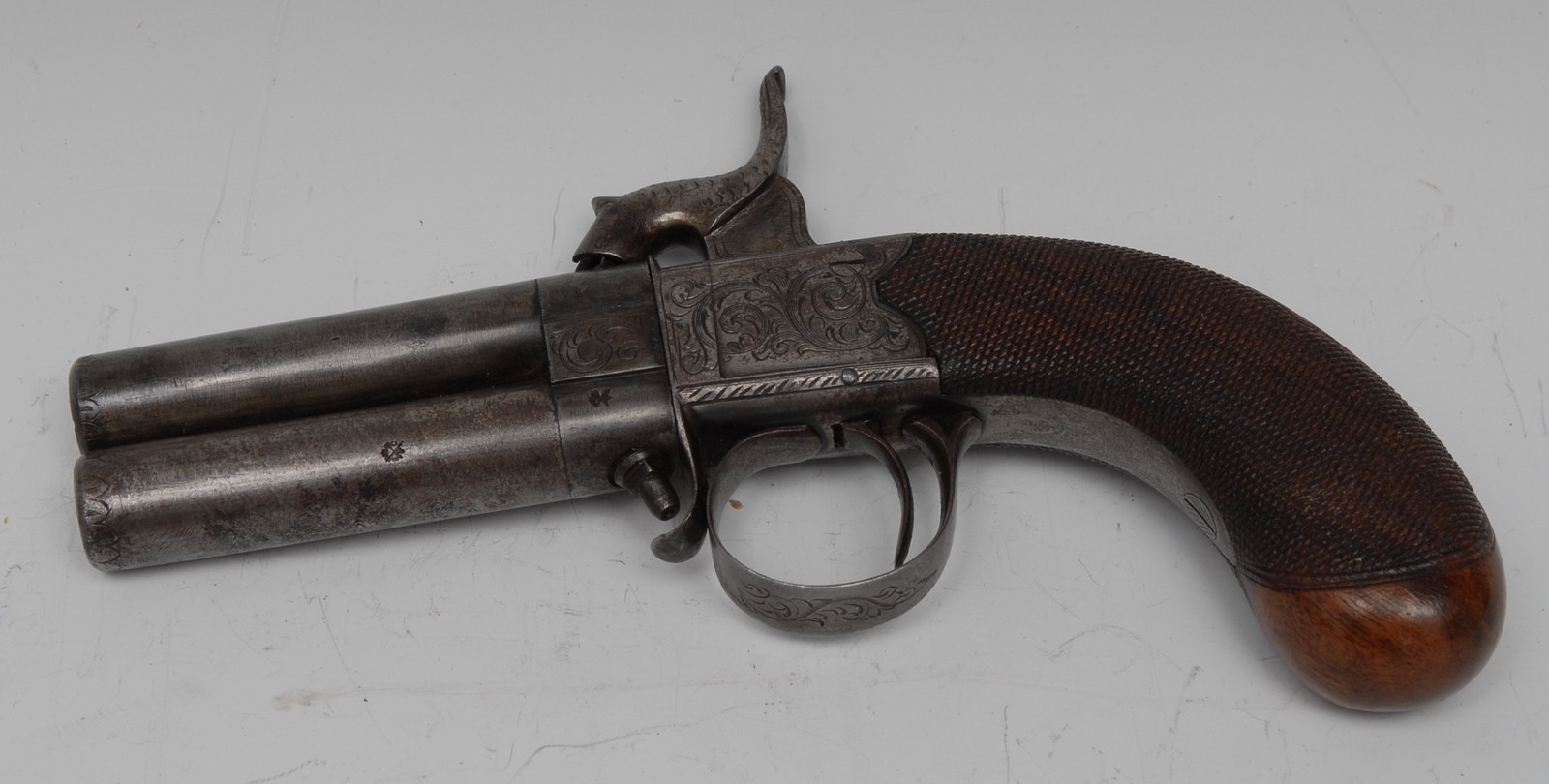 A 19th century over and under double barrel percussion pistol,