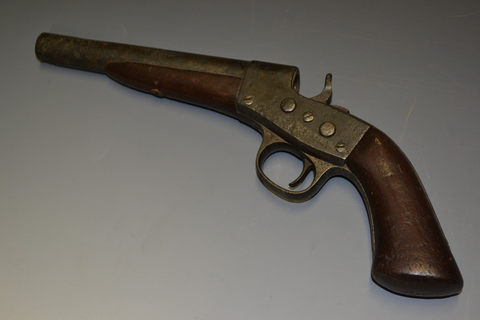 A Remington model 1868 pistol, 15cm barrel, wooden grip,