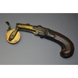 A 19th century gunpowder eprouvette, 4cm barrel with priming pan, circular dial, wooden stock,