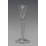 An 18th century wine glass, funnel shaped bowl, multiple air twist stem, folded circular foot, 17.