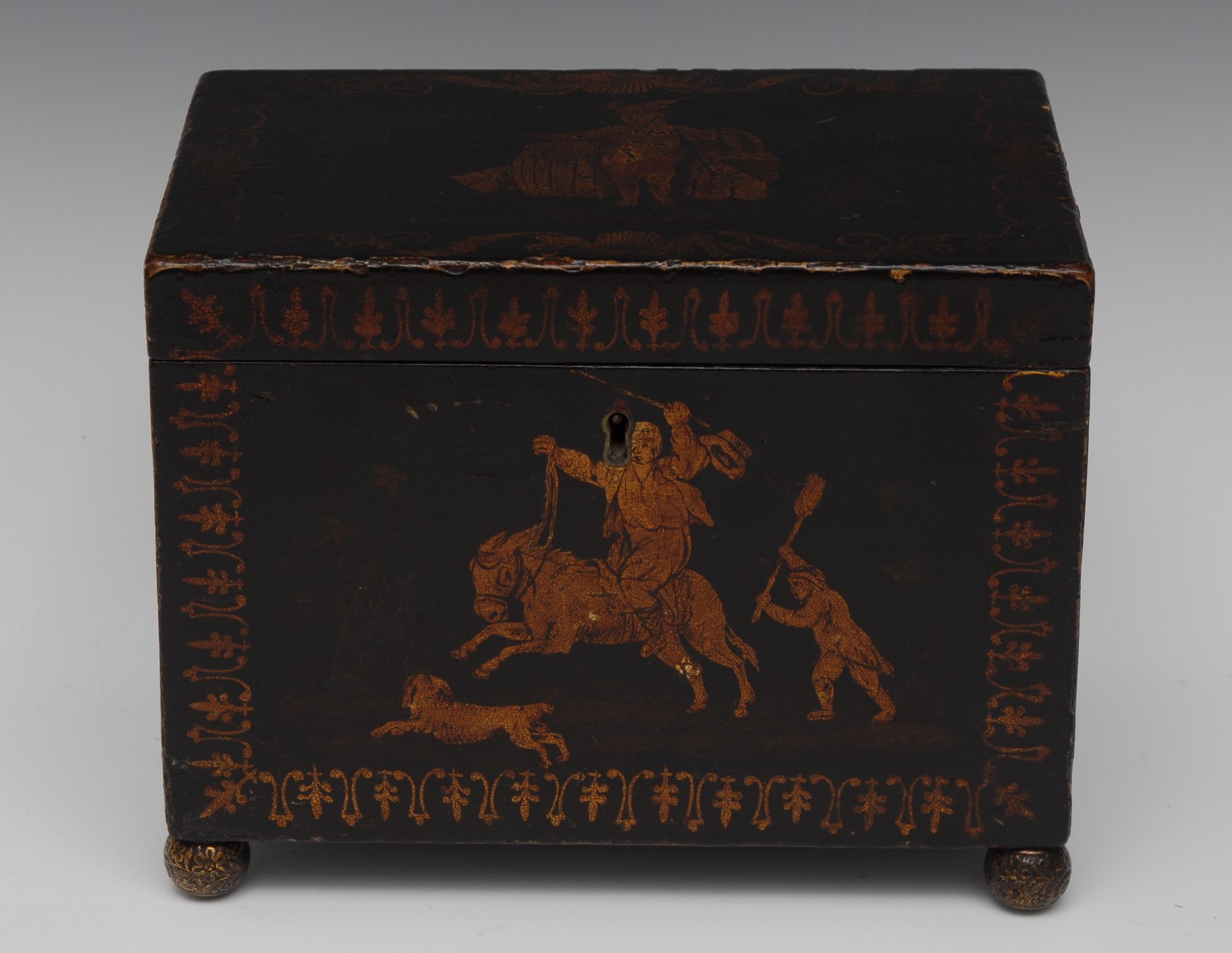 A Regency penwork rectangular tea caddy, hinged cover decorated with a putto dressed as Mercury,