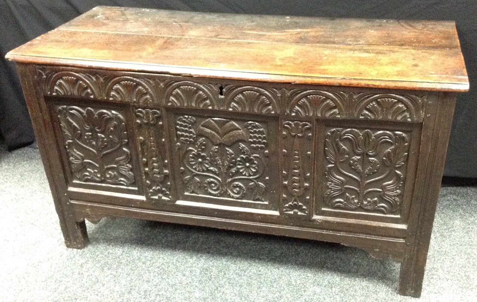 An 18th century oak coffer, two plank hinged top,