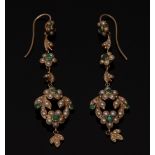 A pair of Edwardian style emerald and seed pearl earrings, each arched loop,