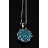 A diamond quartz and blue zircon pendant, central oval quartz cabochon,