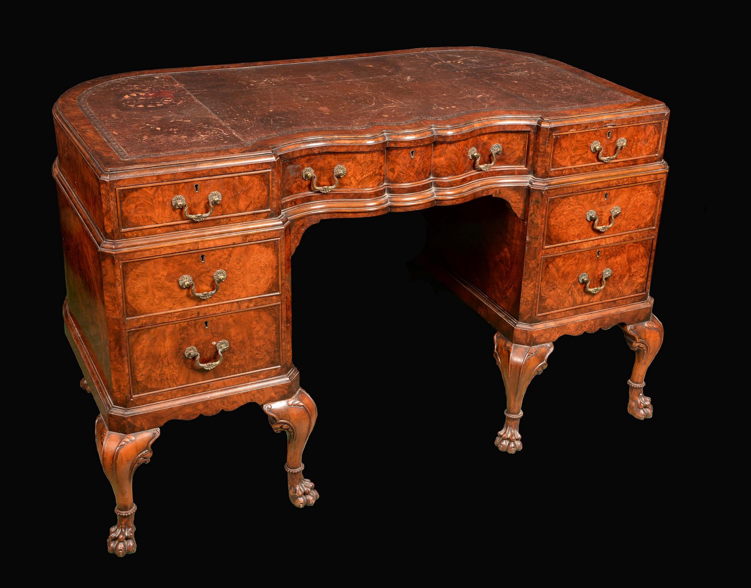 An 18th century design walnut shaped serpentine twin pedestal desk,