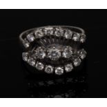 A nineteen stone diamond cluster ring, central row of three round brilliant cut diamonds,