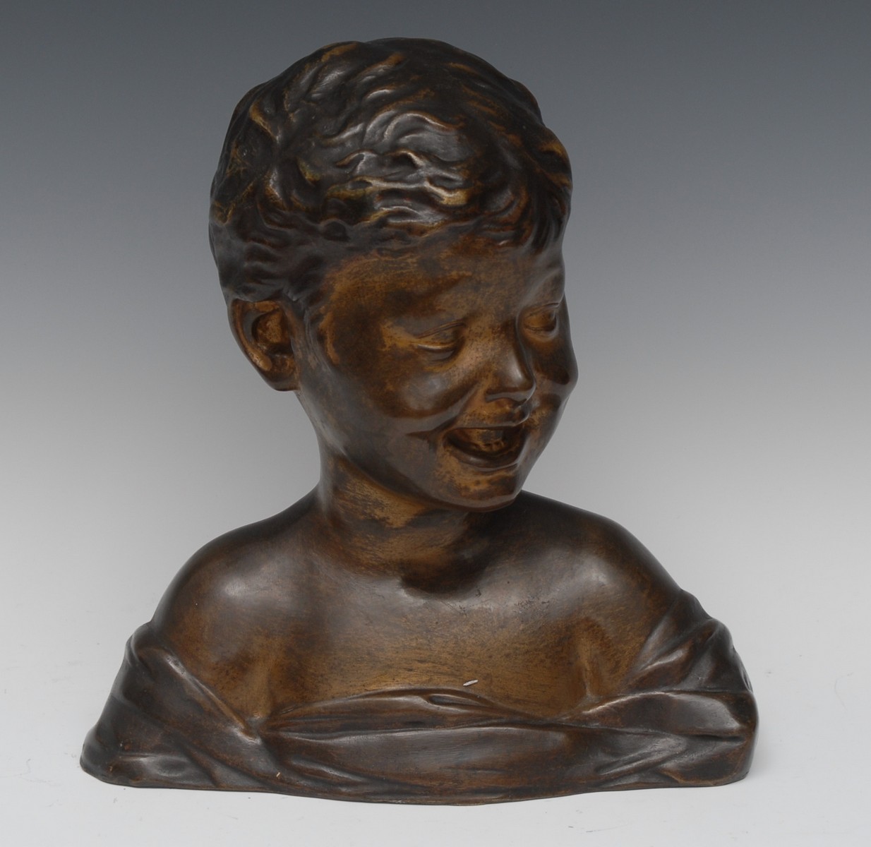 Continental School (early 20th century), a patinated bronze bust, Carefree Days,