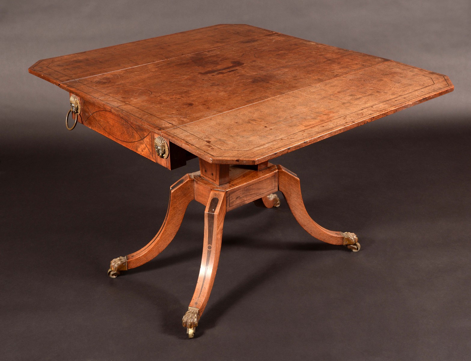 A Regency Egyptian Revival brass mounted mahogany pembroke table,