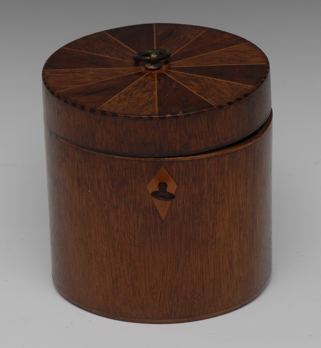 An unusual 19th century cylindrical tea caddy, hinged cover with brass ring finial,