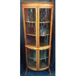 An Edwardian rosewood crossbanded satinwood bow fronted corner display cabinet,