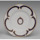 Buckingham Palace - a shaped circular plate, the centre with crest,