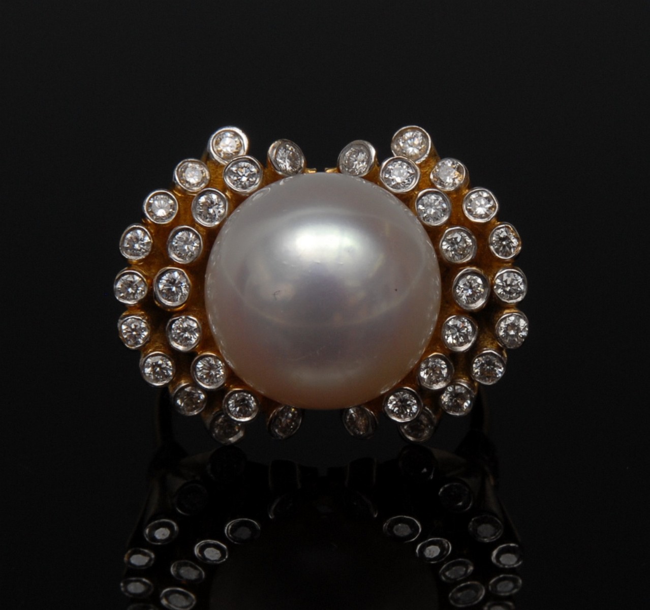 A pearl and diamond ring, central creamy pearl, 13.